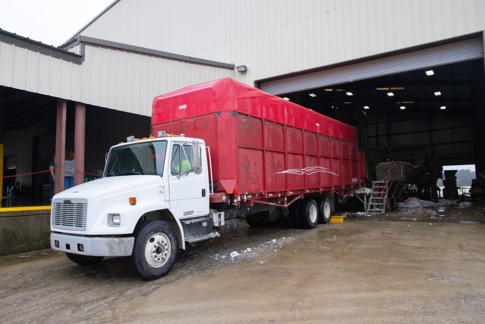 Straight truck positioned at a freight facility