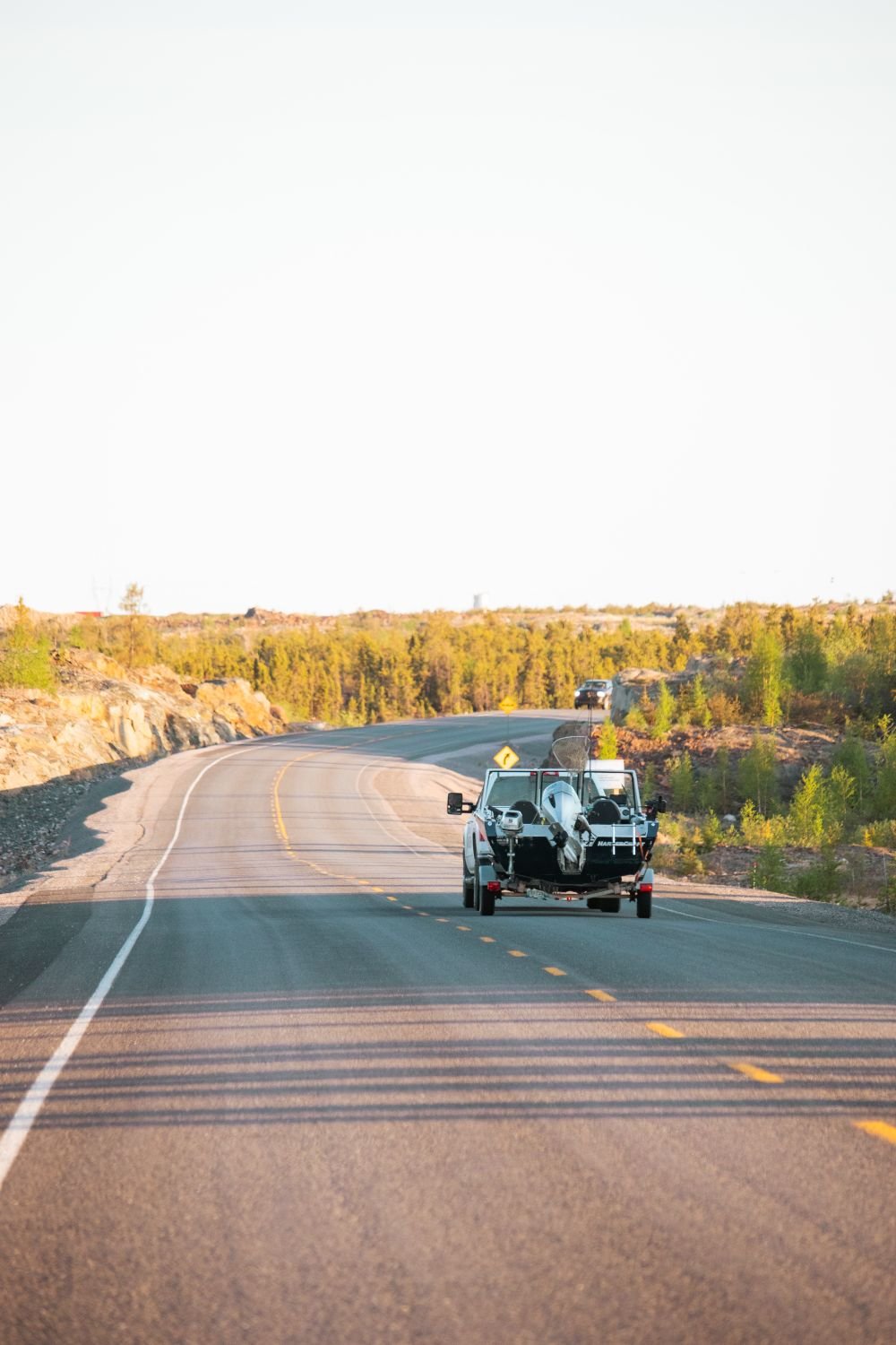 Pickup truck towing a trailer on the highway